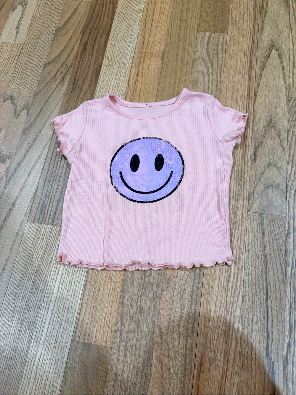 Denny’s light pink ribbed tee with purple smiley face